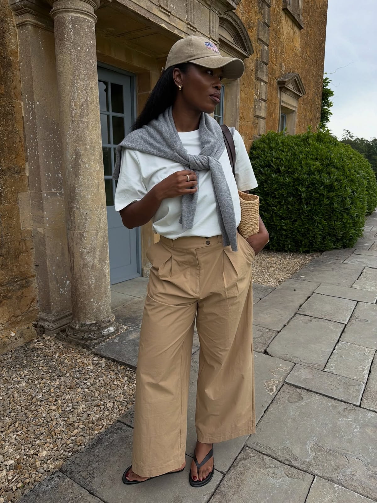 Wide-Leg Trousers With Sweater Tied Over Shoulders Wide-Leg Trousers With Sweater Tied Over Shoulders — Khaki Pants Outfits 2027
