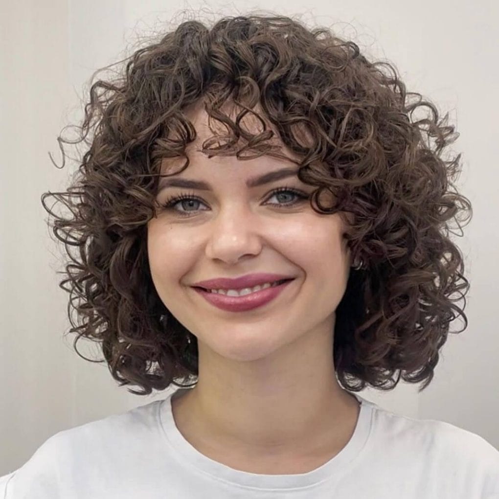 Chin Length Dark Bob With Short Bangs Chin Length Dark Bob With Short Bangs — Loose Perm 2027
