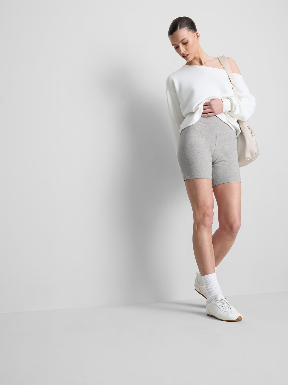 Relaxed Athleisure: Grey Biker Shorts with Cut-Out Top — Biker Shorts Outfits 2027