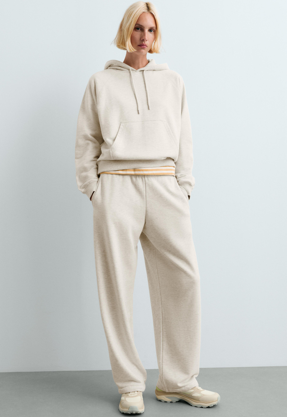 Outfit Idea — She Wears Athletic Sneakers Cream Outfits 2027