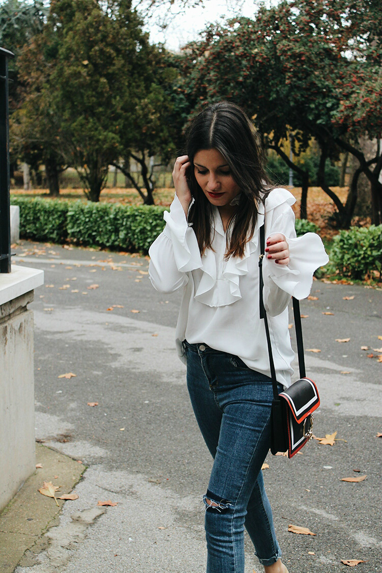White Ruffle Blouse and Ripped Jeans for an Edgy Casual Combination White Ruffle Blouse and Ripped Jeans for an Edgy Casual Combination — Ruffle Top Outfits 2027