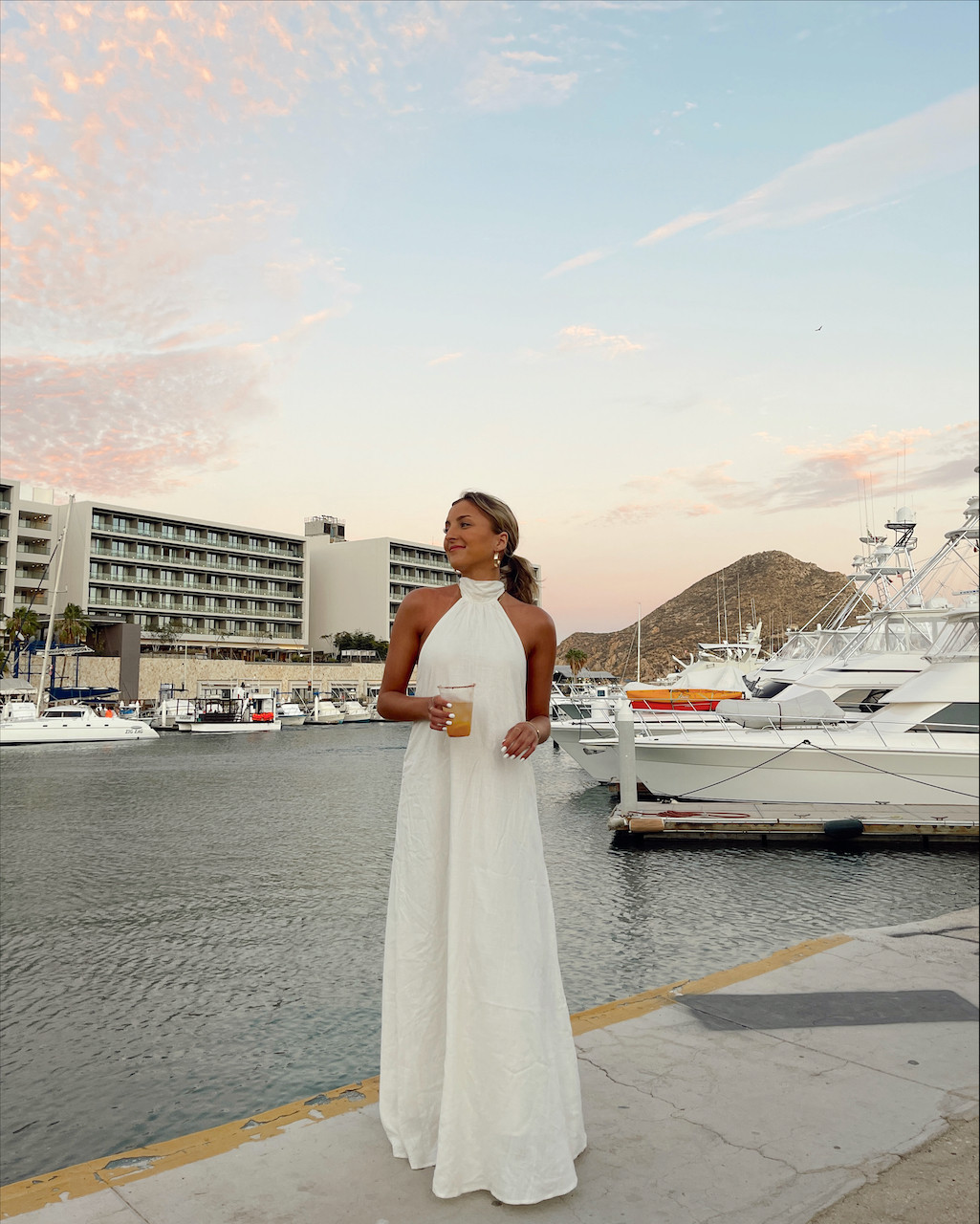 Flowing White Halter-Neck Maxi Dress for Coastal Evenings Flowing White Halter-Neck Maxi Dress for Coastal Evenings — Cabo Outfits 2027