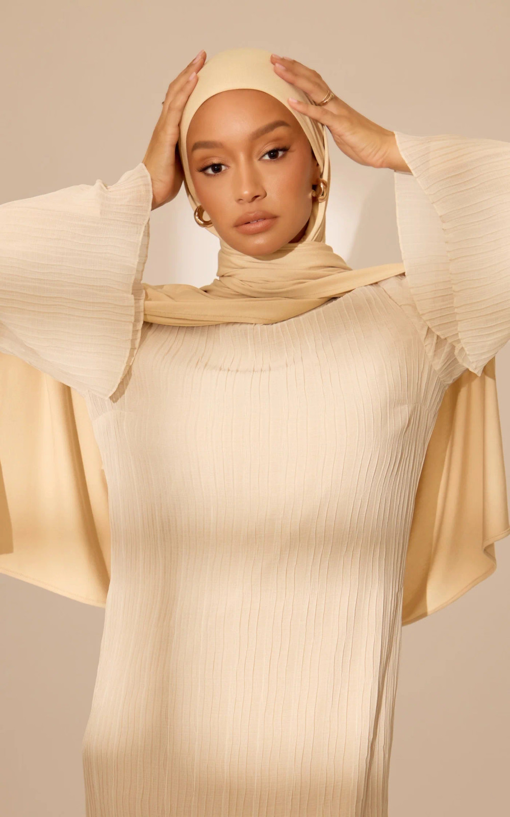 Cream Pleated Top with Voluminous Sleeves Cream Pleated Top with Voluminous Sleeves — Hijab Outfits 2027