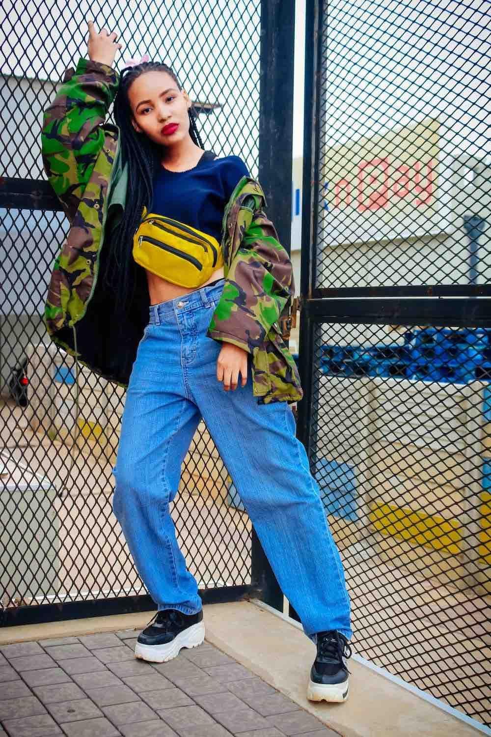 Camouflage Jacket and Yellow Bag with Blue Wide-Leg Jeans — Wide Leg Jeans Outfits 2027