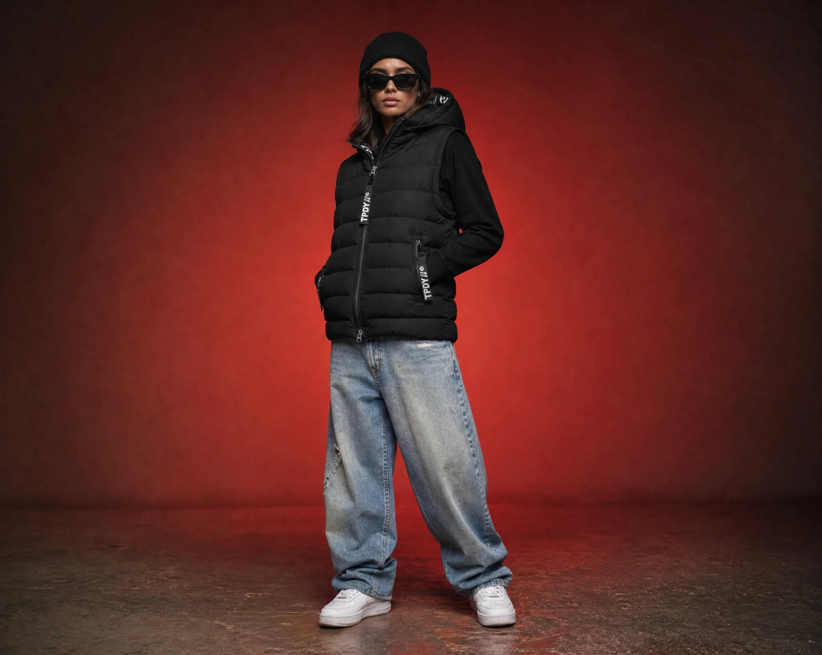 Streetwear Ready: Black Logo Vest with Hoodie and Baggy Jeans Streetwear Ready: Black Logo Vest with Hoodie and Baggy Jeans — Puffer Vest Outfits 2027