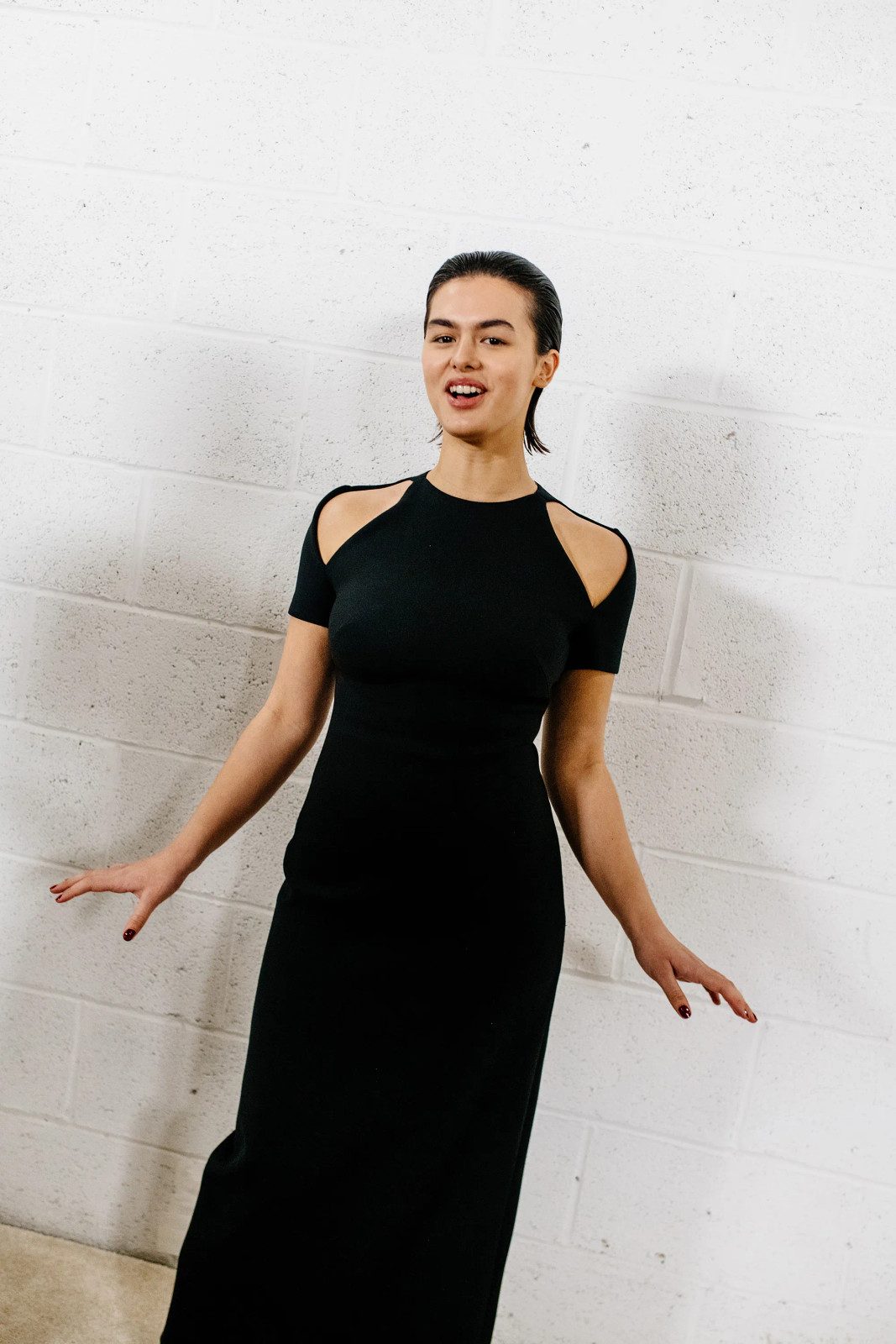 Edgy Detail: Black Knit Dress with Cut-Out Shoulders — Holiday Party Outfits 2026