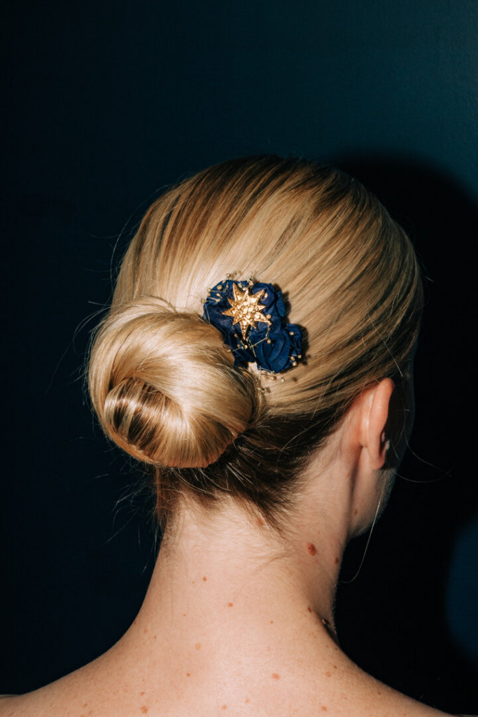 Polished Blonde Bun With Star Accessory — Christmas Hairstyles 2026