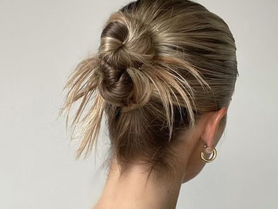 Visual Idea — A Messy Bun Is Styled From Wavy Visual Idea — A Messy Bun Is Styled From Wavy — Summer Buns 2027
