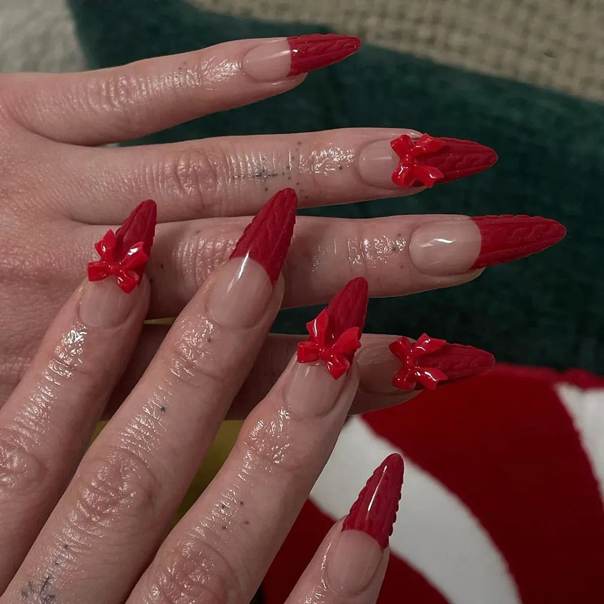 Textured Red Bows on Stiletto French Textured Red Bows on Stiletto French — Christmas Bow Nails 2026