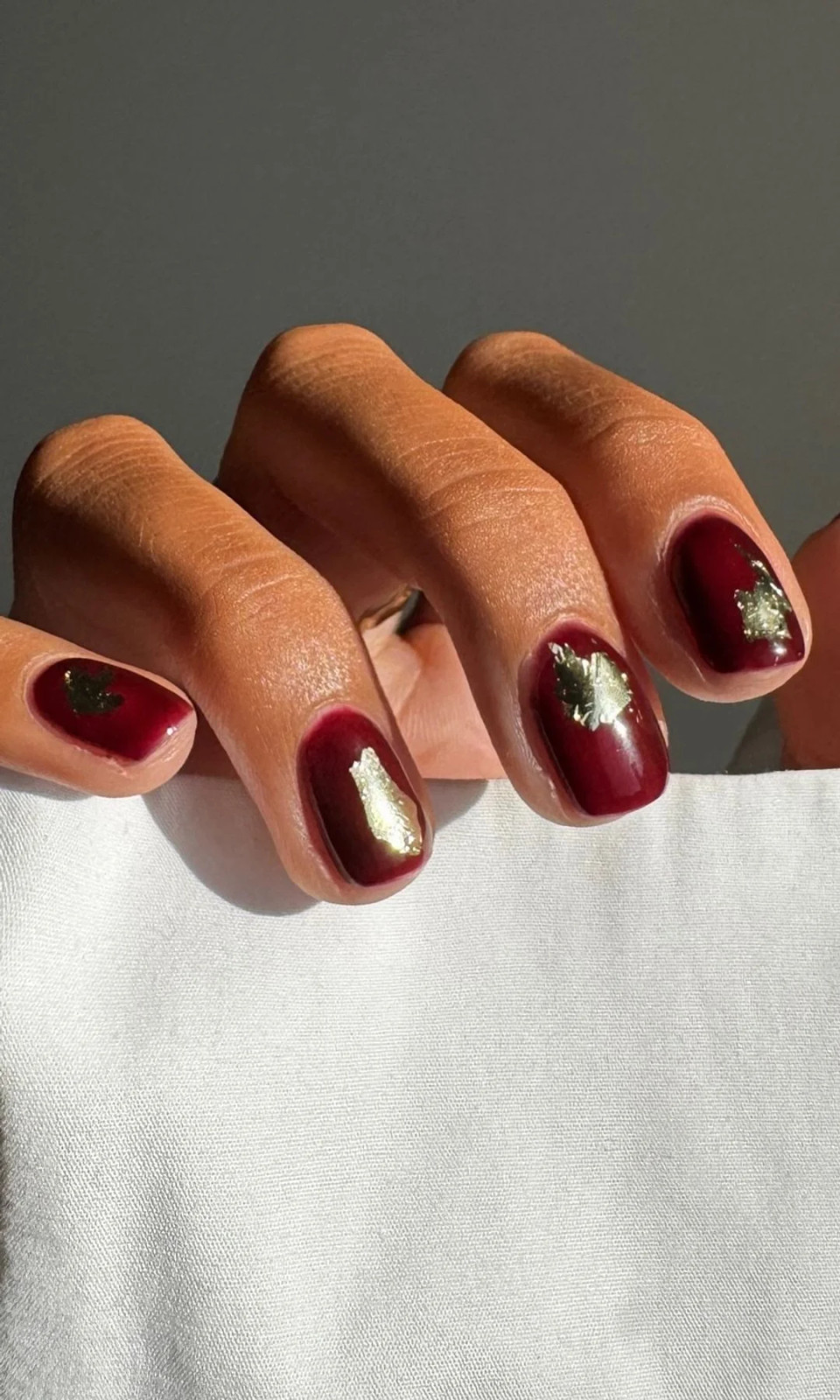 Burgundy with Gold Foil Accents Burgundy with Gold Foil Accents — Burgundy Christmas Nails 2026