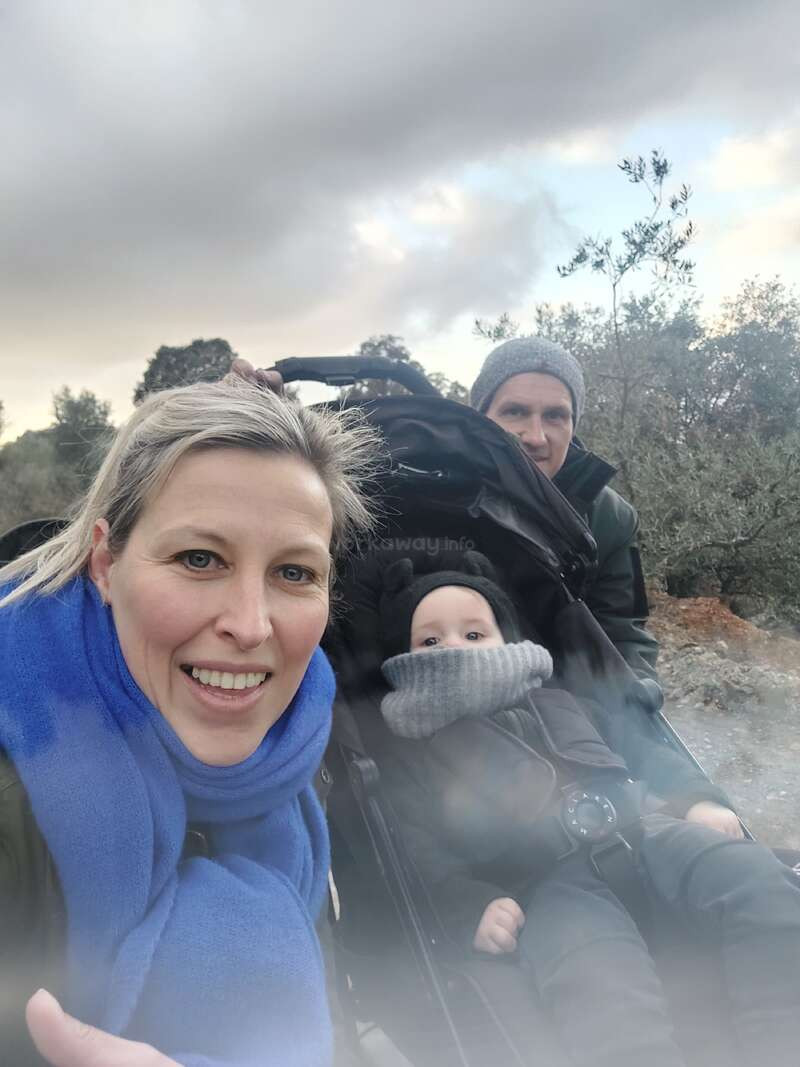 Outdoor Winter Warmth: Green Jacket and Blue Scarf Outdoor Winter Warmth: Green Jacket and Blue Scarf — Winter Family Photo Outfits 2027