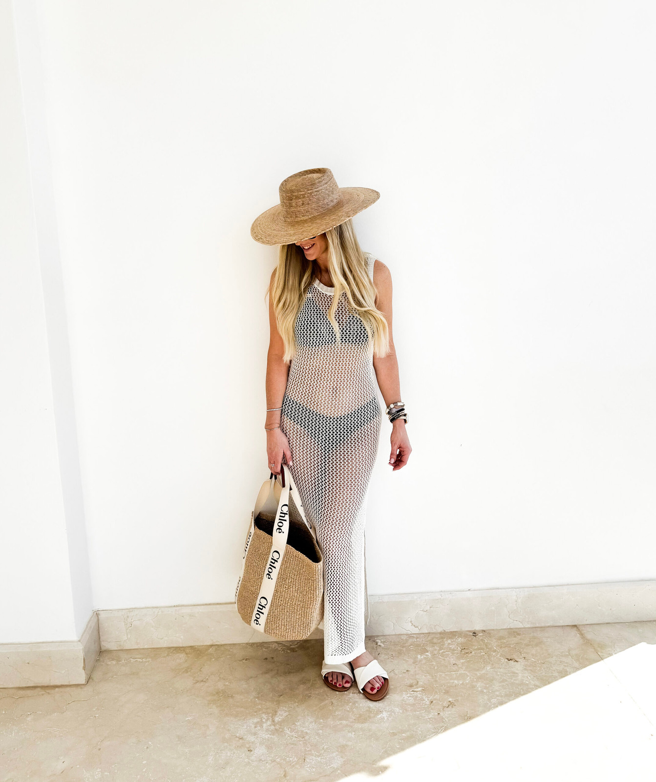 White Crochet Maxi Dress over Black Bikini for Beach Resort White Crochet Maxi Dress over Black Bikini for Beach Resort — Cabo Outfits 2027