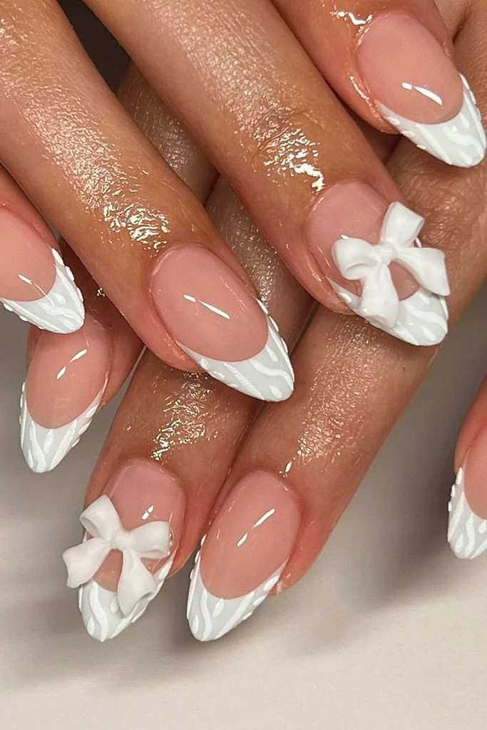 The Prominent 3D White Bows On The Nails Sheer Pink Stilettos with Textured French and 3D Bows The Prominent 3D White Bows On The Nails Sheer Pink Stilettos with Textured French and 3D Bows — Bow Stiletto Nails 2027