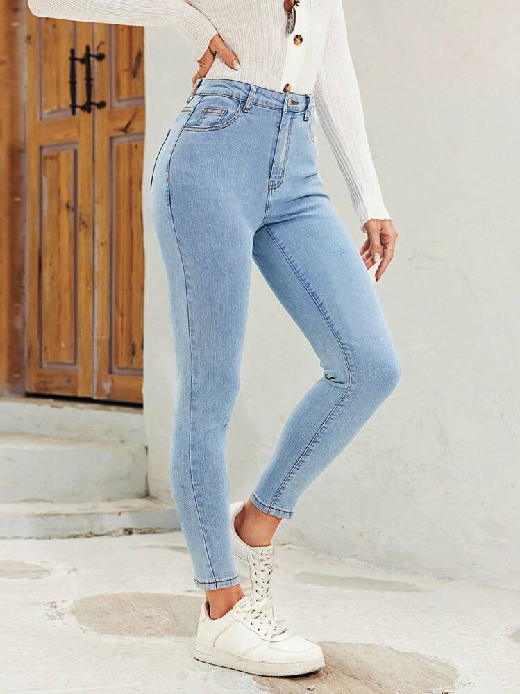 High-Waisted Light Blue Skinny Jeans with White Knit Top and Sneakers — Scene Skinny Jeans Outfits 2027