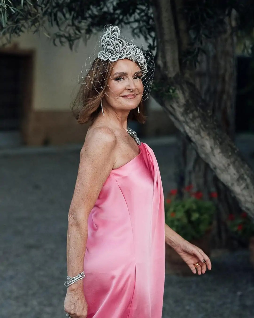 Vibrant Pink One-Shoulder Gown with Ornate Headpiece Vibrant Pink One-Shoulder Gown with Ornate Headpiece — Wedding Guest Outfits 2027 for Women Over 50