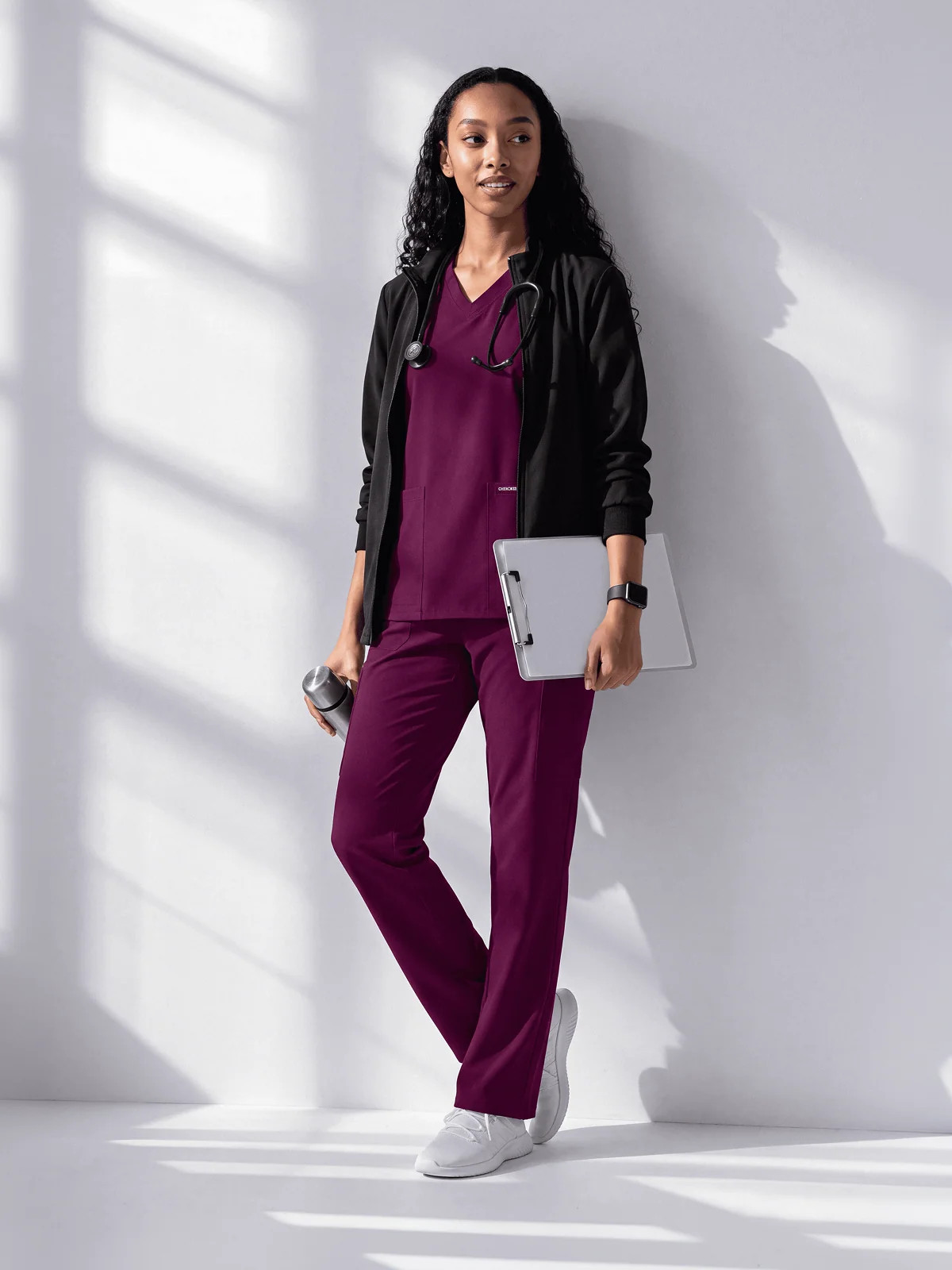 Burgundy Scrubs with a Black Zip-Up Jacket and Accessories Burgundy Scrubs with a Black Zip-Up Jacket and Accessories — Scrubs Outfits 2027