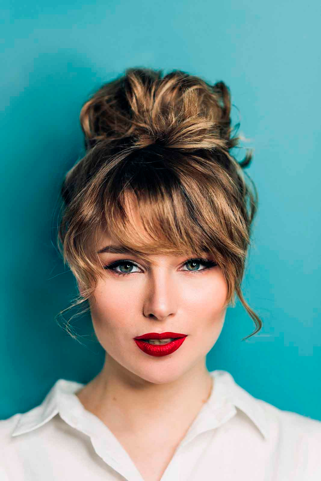 Messy High Bun With Wispy Fringe Messy High Bun With Wispy Fringe — Prom Hairstyles 2027 with Bangs