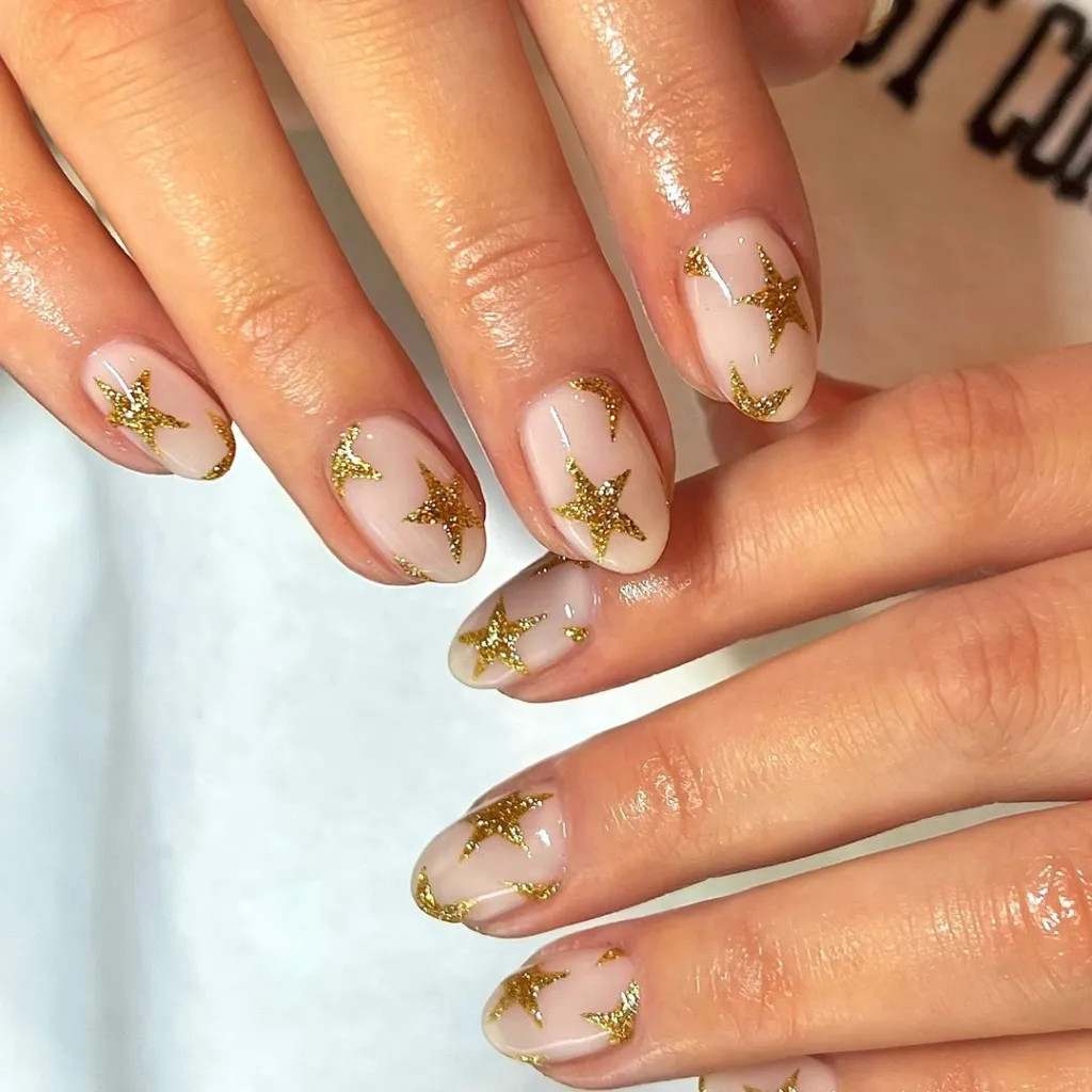 Gold Glitter Stars And Crescent Moons Visual Idea Gold Glitter Stars And Crescent Moons Visual Idea — Gold Christmas Nails 2026