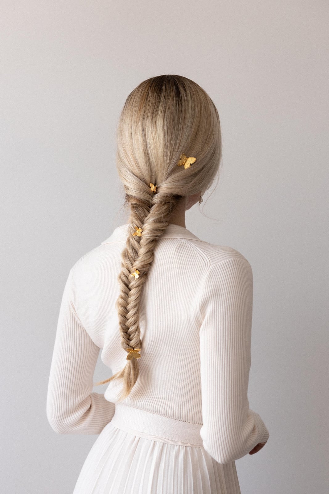 Light Blonde Neat Fishtail Braid With Butterfly Clips Light Blonde Neat Fishtail Braid With Butterfly Clips — Mermaid Braid 2027