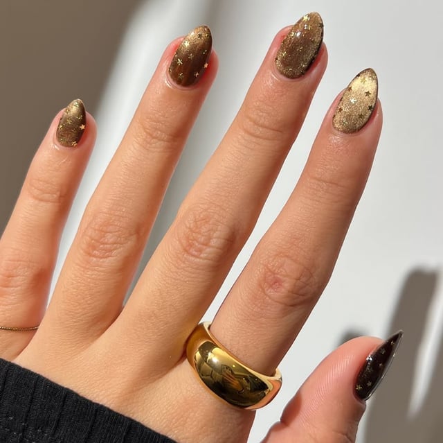Medium Almond Dark Brown Gold Stars Medium Almond Dark Brown Gold Stars — Muted Metallic Nails 2027