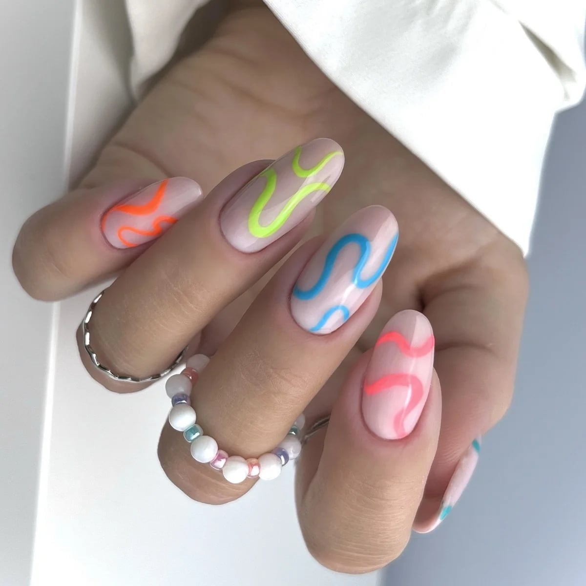 Oval Medium Beige Wavy Neon Lines Oval Medium Beige Wavy Neon Lines — Neon Oval Nails 2027