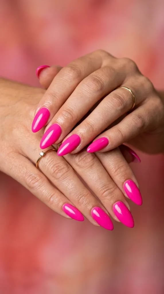 Medium Almond Neon Pink Nails with Gold Ring, Close-Up Take Medium Almond Neon Pink Nails with Gold Ring, Close-Up Take — Neon Pink Nails 2027