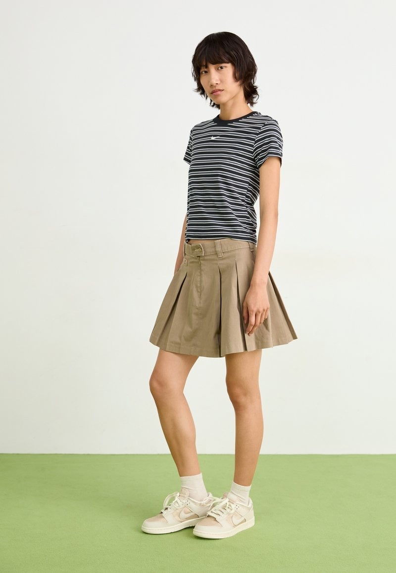 Beige Sneakers with Pleated Mini Skirt Beige Sneakers with Pleated Mini Skirt — Nike Dunk Outfits 2027
