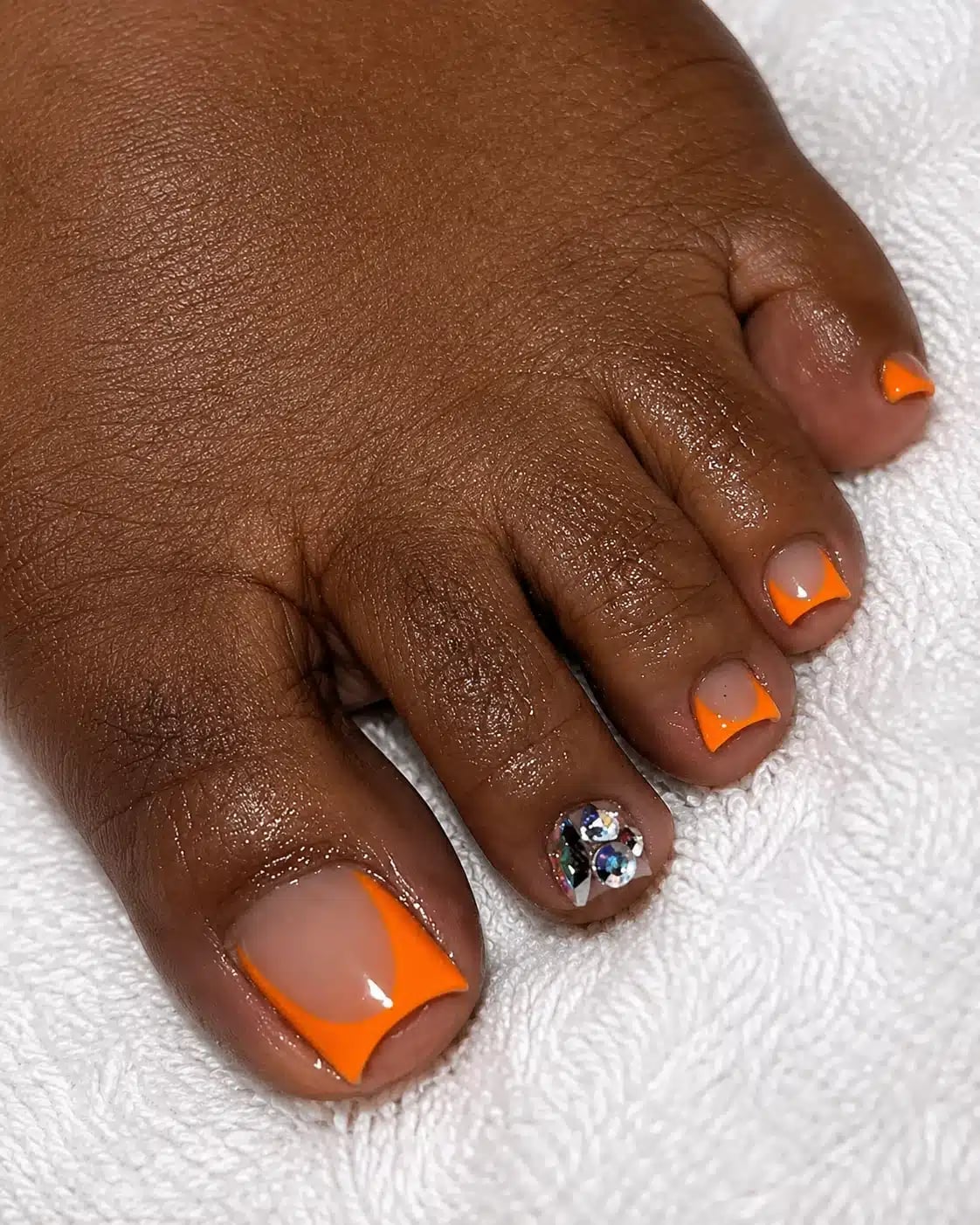 Orange French Tips with Rhinestone Accent Orange French Tips with Rhinestone Accent — Orange Toe Nails 2027