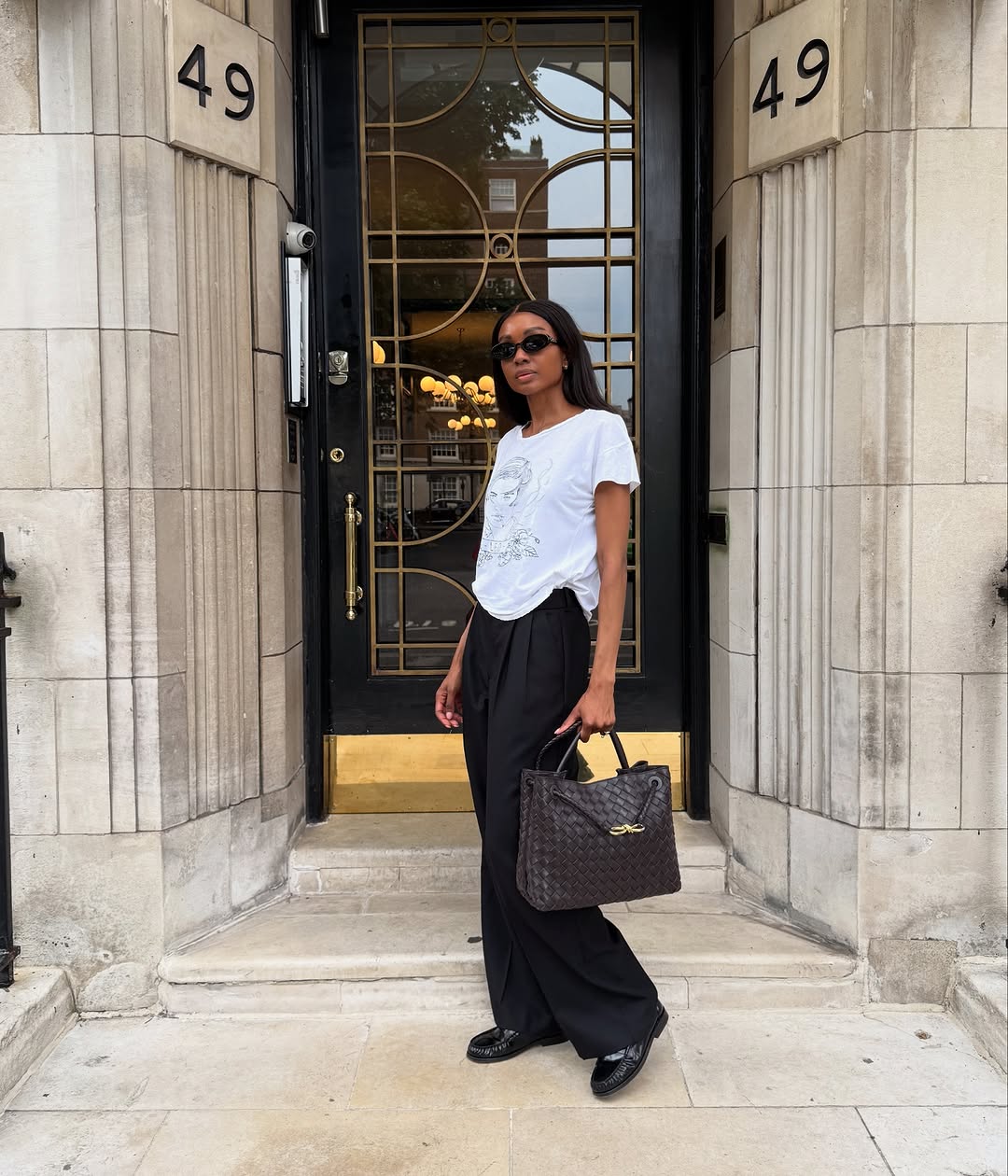 Black Penny Loafers With Wide-Leg Trousers And Graphic, Close-Up Take Black Penny Loafers With Wide-Leg Trousers And Graphic, Close-Up Take — Penny Loafers Outfits 2027