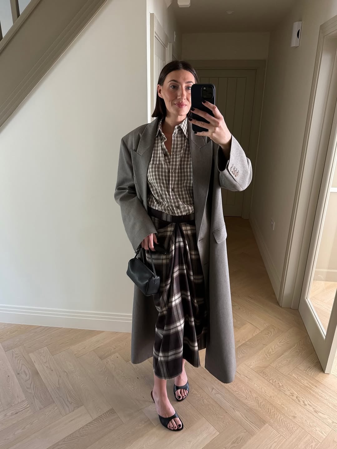 Brown Plaid Draped Midi Skirt With Oversized Coat, Black Heeled Mules Brown Plaid Draped Midi Skirt With Oversized Coat, Black Heeled Mules — Plaid Pleated Skirt Outfits 2027