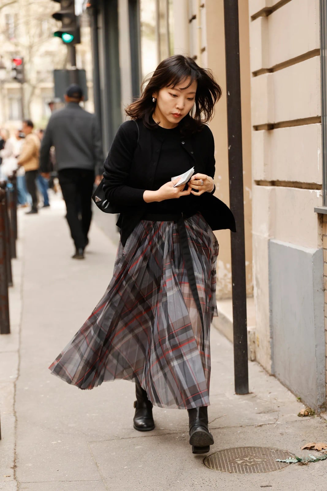 Gray Red Plaid Sheer Pleated Skirt With Black Cardigan, Close-Up Take Gray Red Plaid Sheer Pleated Skirt With Black Cardigan, Close-Up Take — Plaid Pleated Skirt Outfits 2027