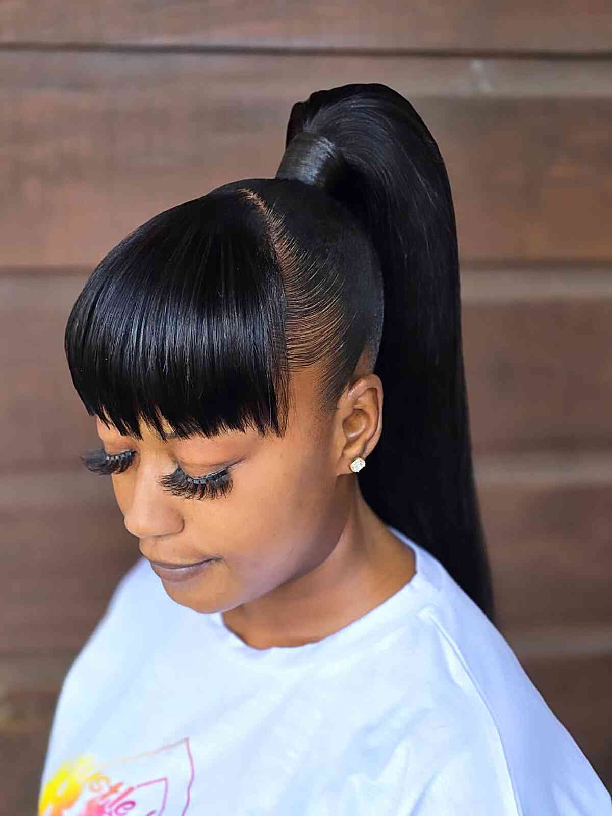 High Sleek Black Ponytail With Blunt Bangs High Sleek Black Ponytail With Blunt Bangs — Ponytail Disney Hairstyles 2027