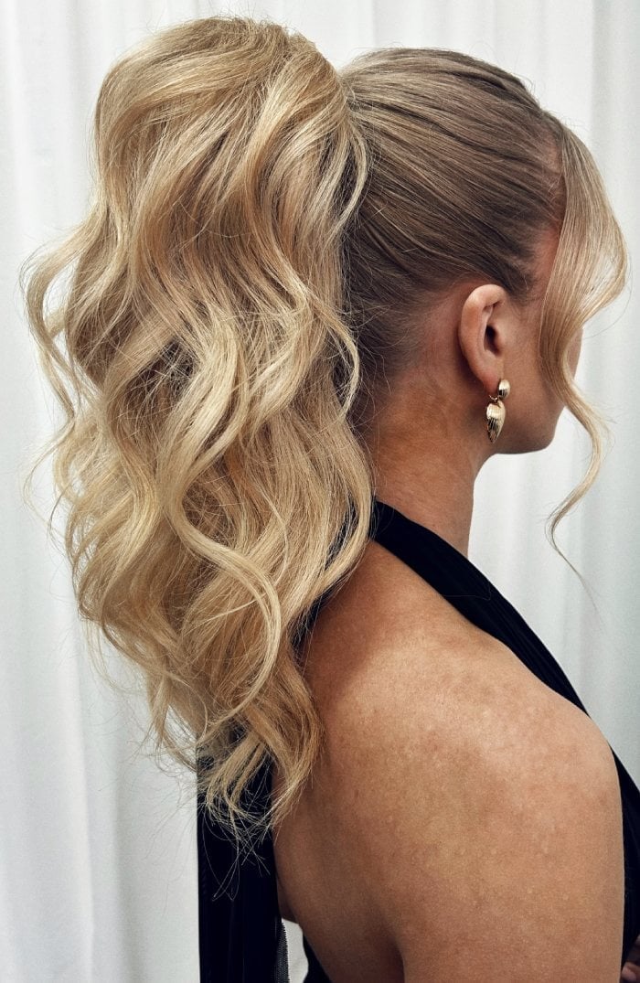 High Ponytail With Voluminous Waves And Face-Framing Pieces High Ponytail With Voluminous Waves And Face-Framing Pieces — Ponytail Hairstyles 2027 for Long Hair