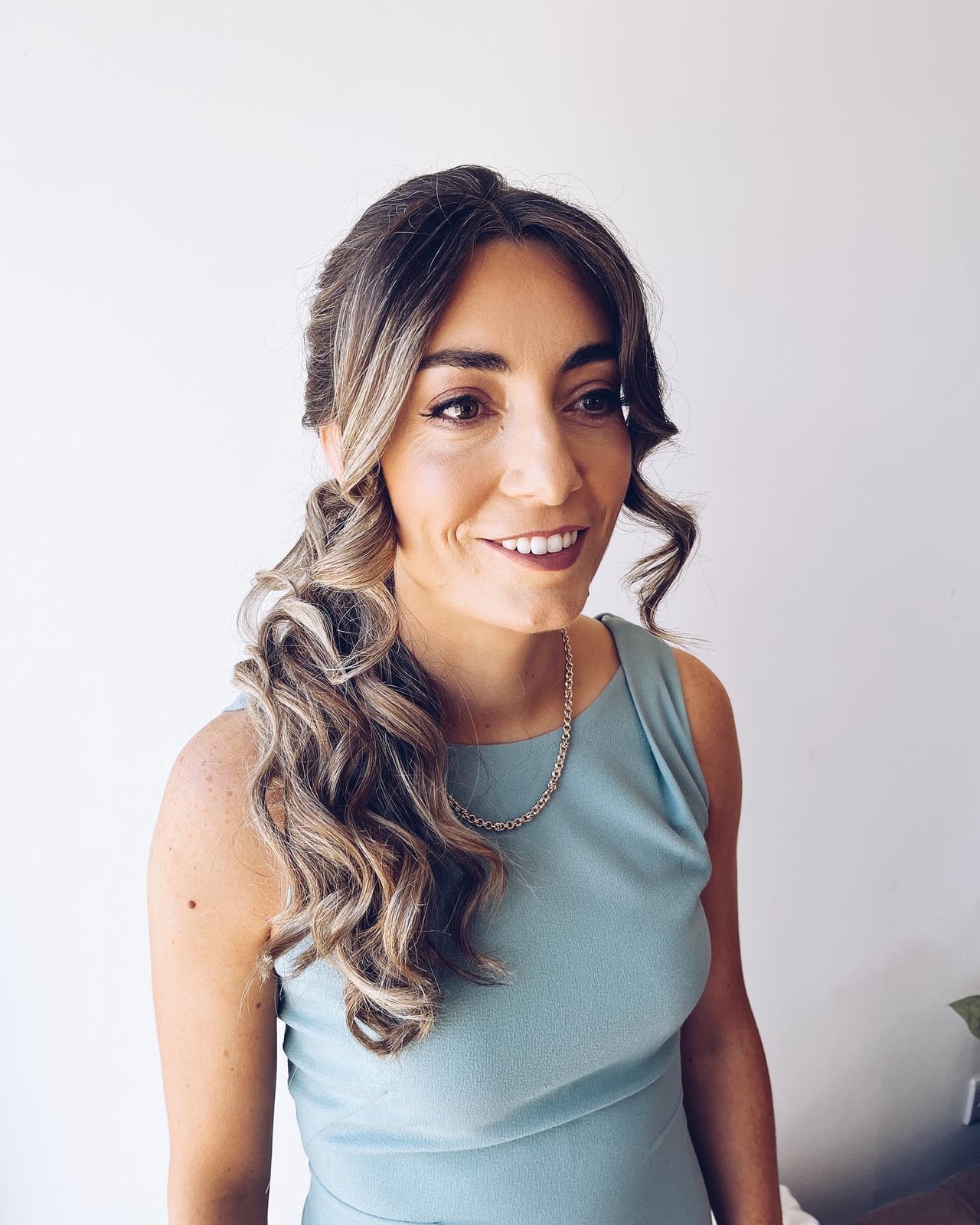 Side Ponytail With Loose Curls Side Ponytail With Loose Curls — Ponytail Hairstyles 2027 for Women Over 40