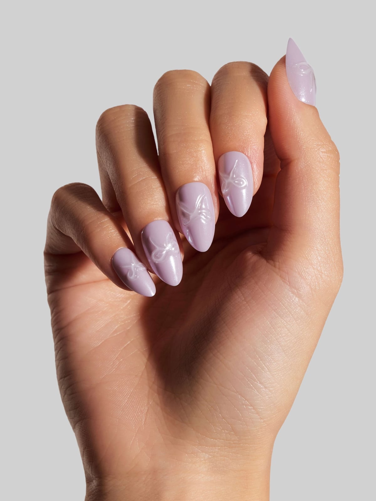 Glossy Lilac Nails with Embossed Bows, Short Almond Glossy Lilac Nails with Embossed Bows, Short Almond — Purple Bow Nails 2027