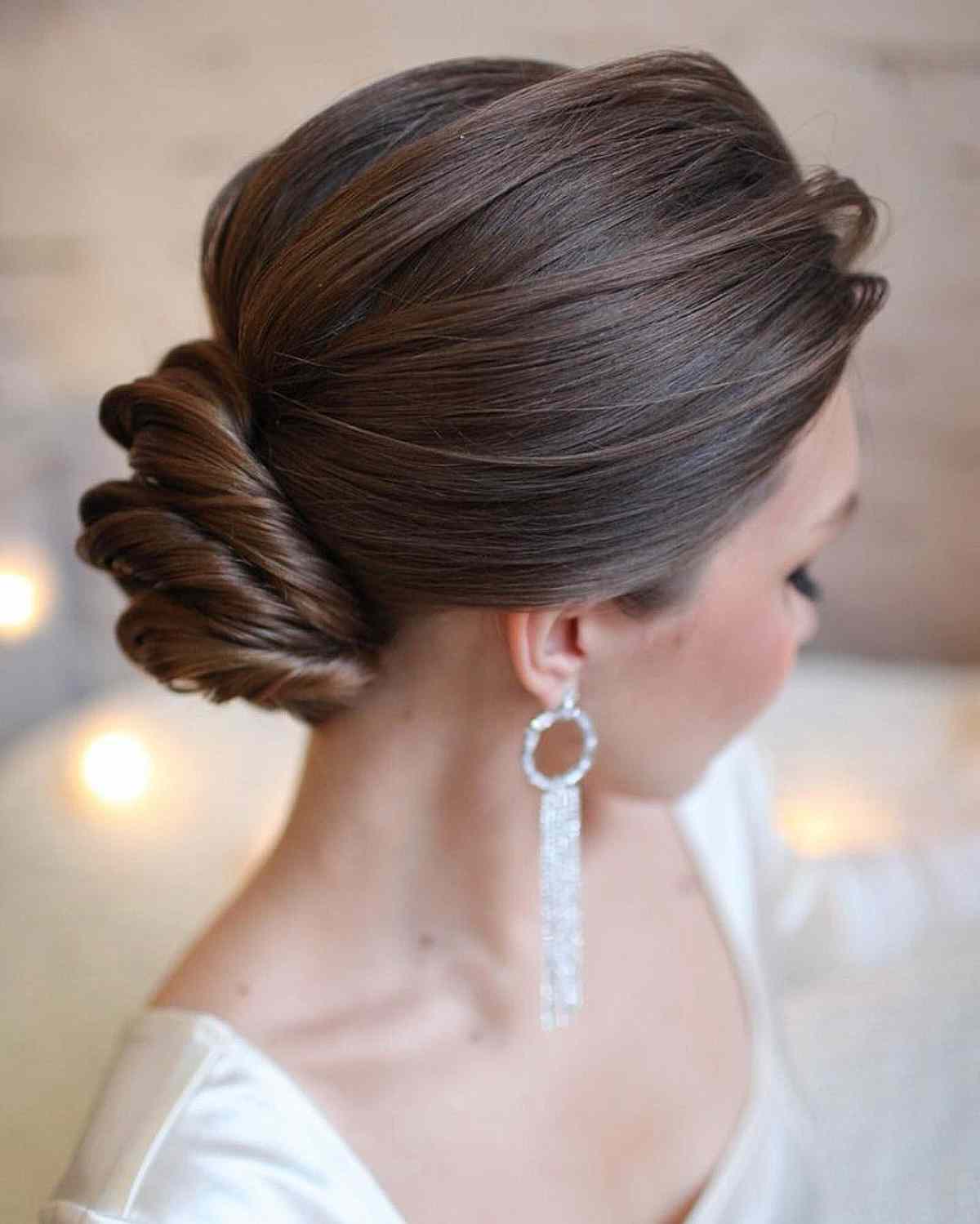 Intricate Dark Brown Twisted Low Bun Intricate Dark Brown Twisted Low Bun — Quick Quinceanera Hairstyles 2027