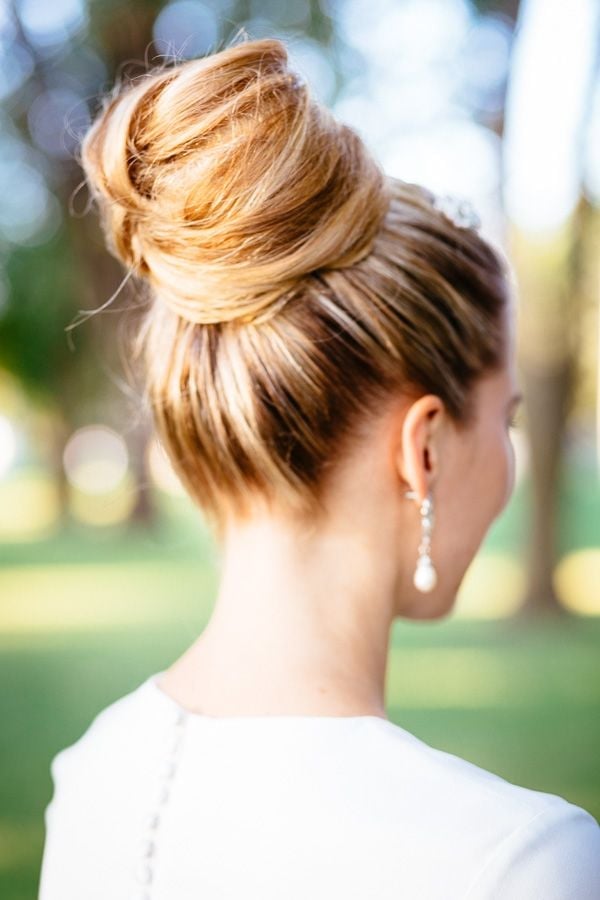 Blonde Half-Up Twisted Floral Accessory Blonde Half-Up Twisted Floral Accessory — Quick Quinceanera Hairstyles 2027
