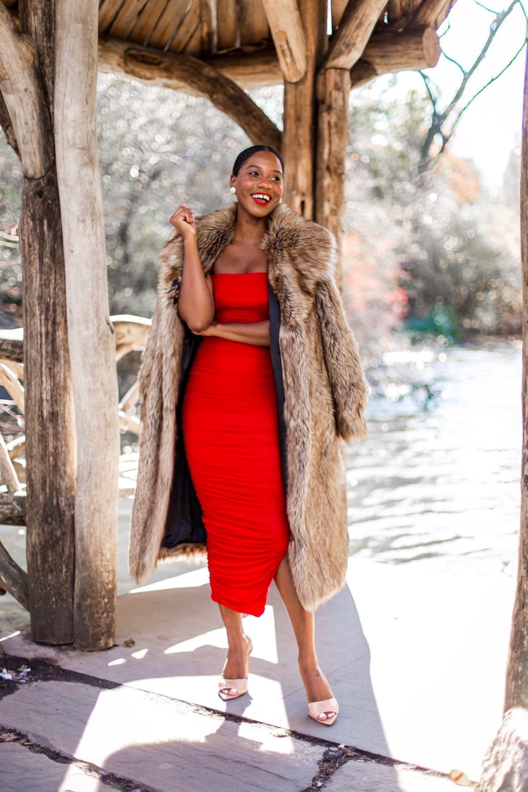 Ruched red midi dress under faux fur coat Ruched red midi dress under faux fur coat — Red New Years Eve Outfits 2027