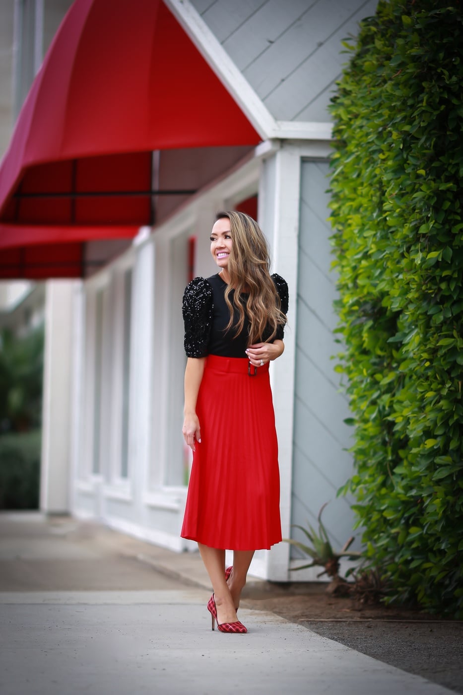 Black sequin top with red pleated midi skirt Black sequin top with red pleated midi skirt — Red New Years Eve Outfits 2027