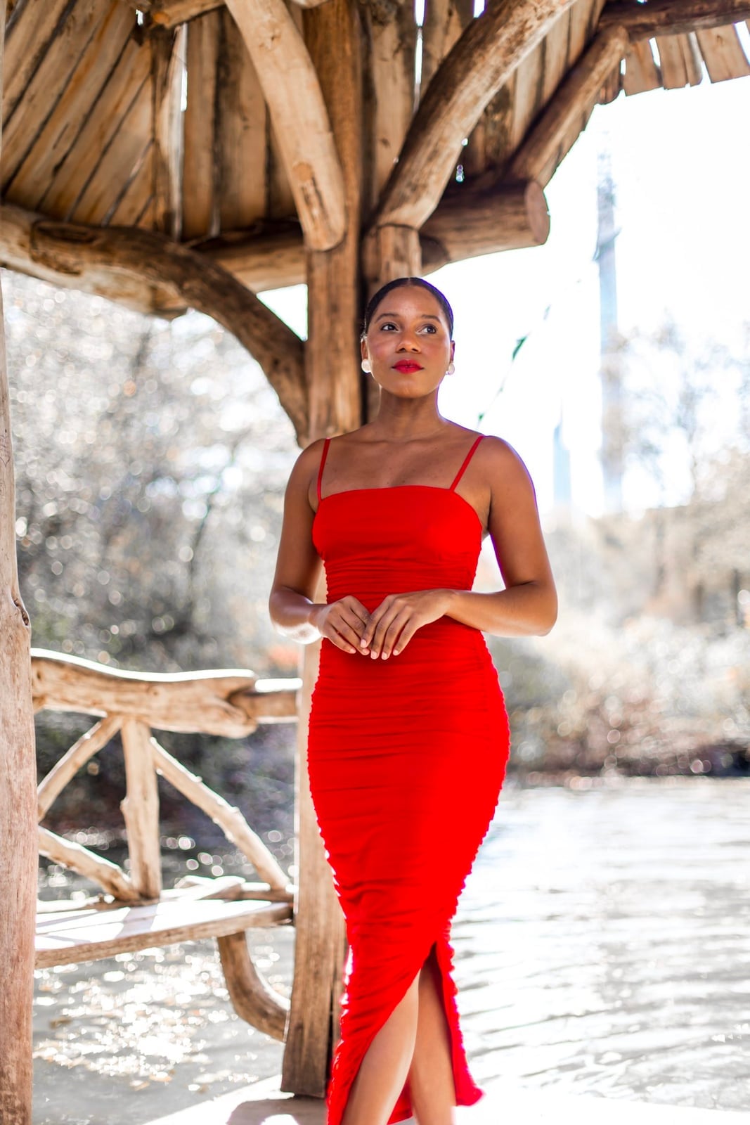 Fitted red ruched midi dress with thigh-high slit Fitted red ruched midi dress with thigh-high slit — Red New Years Eve Outfits 2027