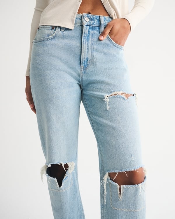 Light blue wide leg jeans with large knee rips detail, Close-Up Take Light blue wide leg jeans with large knee rips detail, Close-Up Take — Ripped Jeans 2027
