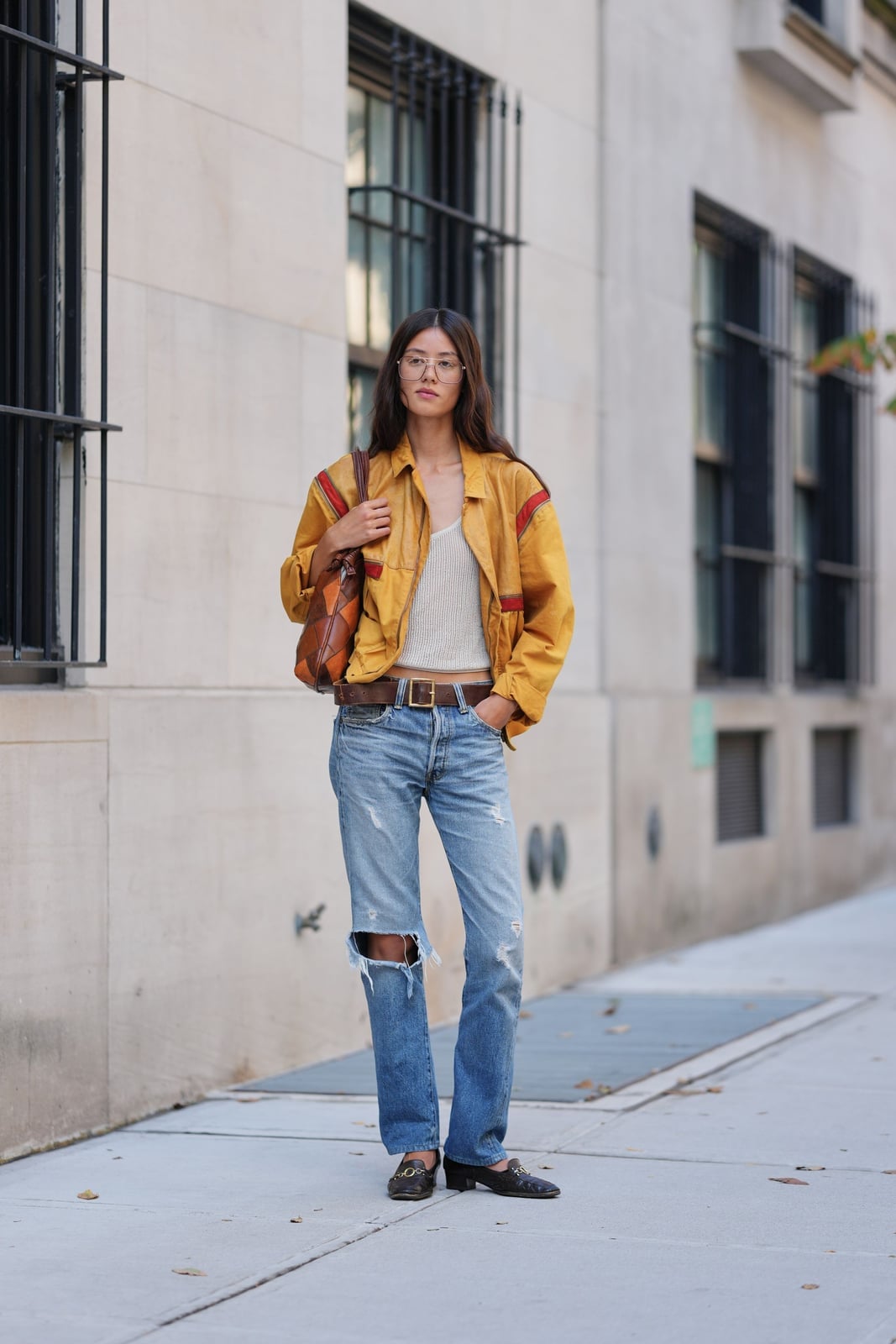 Light blue ripped straight-leg jeans with yellow jacket Light blue ripped straight-leg jeans with yellow jacket — Ripped Jeans 2027