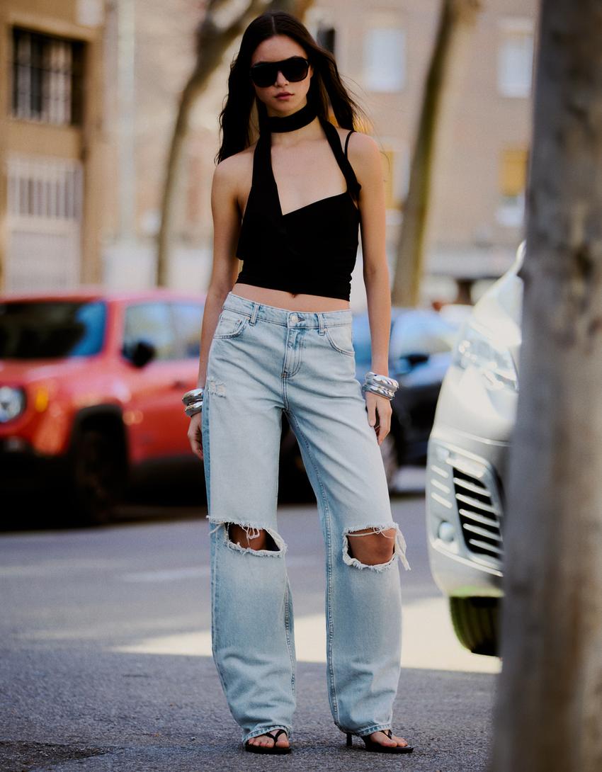 Light blue wide-leg jeans with knee rips Light blue wide-leg jeans with knee rips — Ripped Jeans 2027