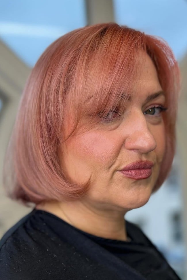 Layered Rose Gold Bob With Side-Swept Bangs — Rose Gold Hair 2027