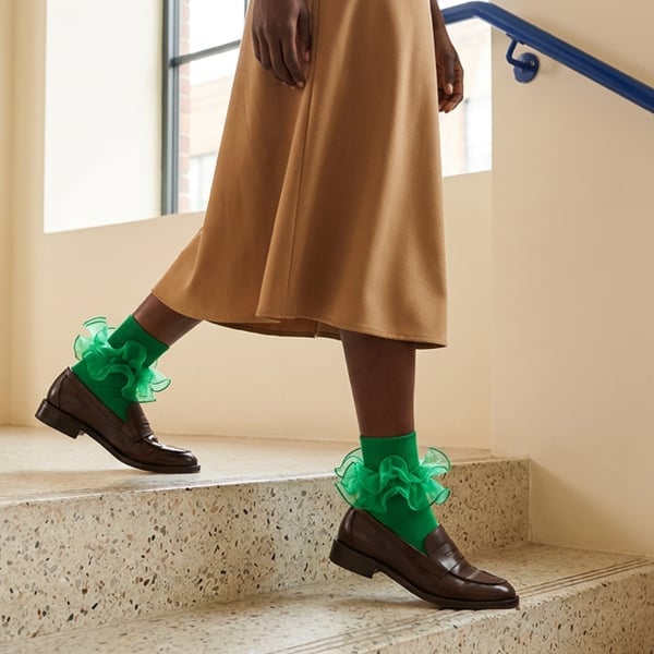 Midi skirt and loafers with bright green ruffle socks Midi skirt and loafers with bright green ruffle socks — Ruffle Socks Outfits 2027
