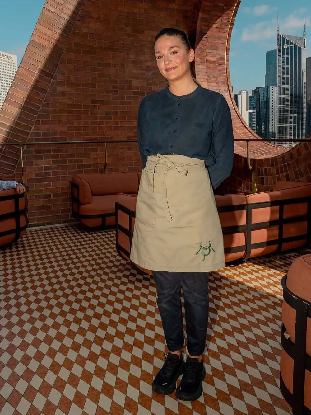 Navy Button-Up With Beige Apron And Slim Trousers Navy Button-Up With Beige Apron And Slim Trousers — Server Outfits 2027