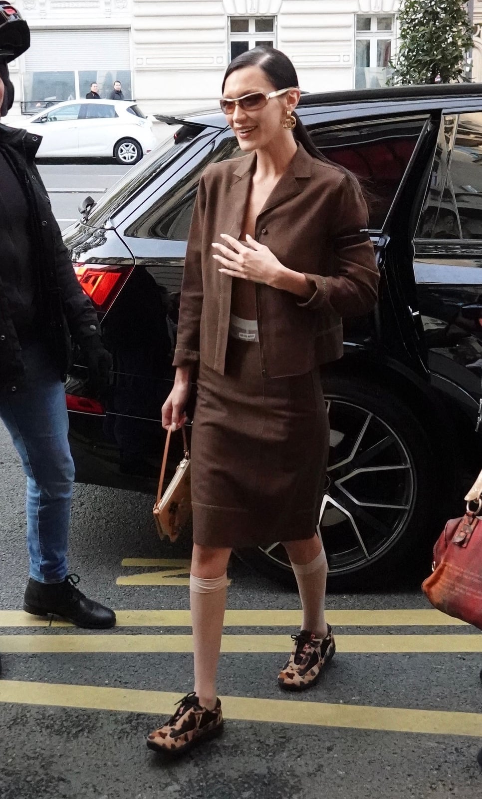 Brown suit with sheer knee-high socks and animal print sneakers Brown suit with sheer knee-high socks and animal print sneakers — Sheer Socks Outfits 2027