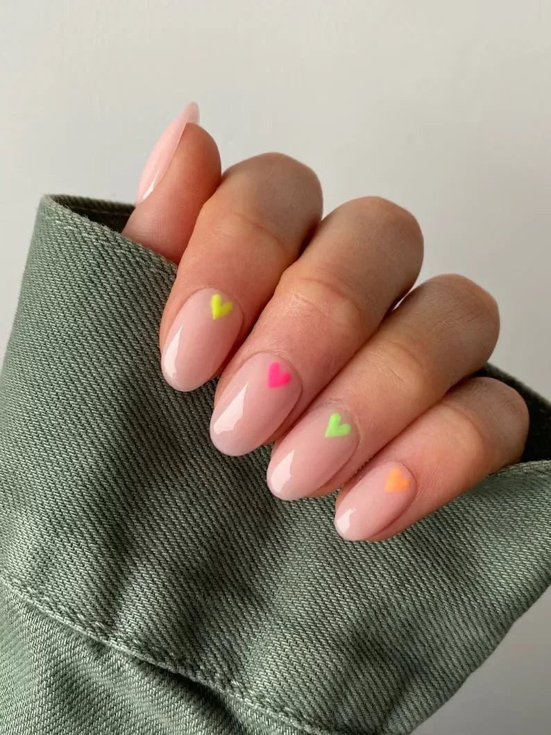 Short Oval Nails Nude With Neon Heart Accents Short Oval Nails Nude With Neon Heart Accents — Short Heart Oval Nails 2027