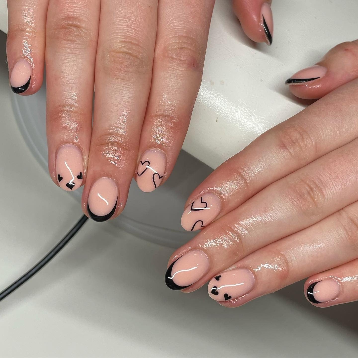 Short Oval Nails Nude With Black Hearts And French Tips Short Oval Nails Nude With Black Hearts And French Tips — Short Heart Oval Nails 2027