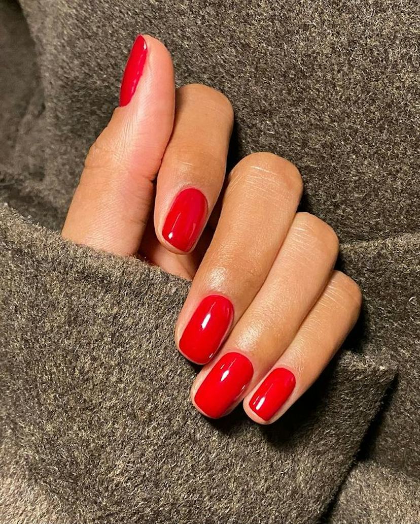 Vivid Glossy Red Short Oval Nails, Focusing On The Nails Vivid Glossy Red Short Oval Nails, Focusing On The Nails — Short Nails 2027 for Mature Hands